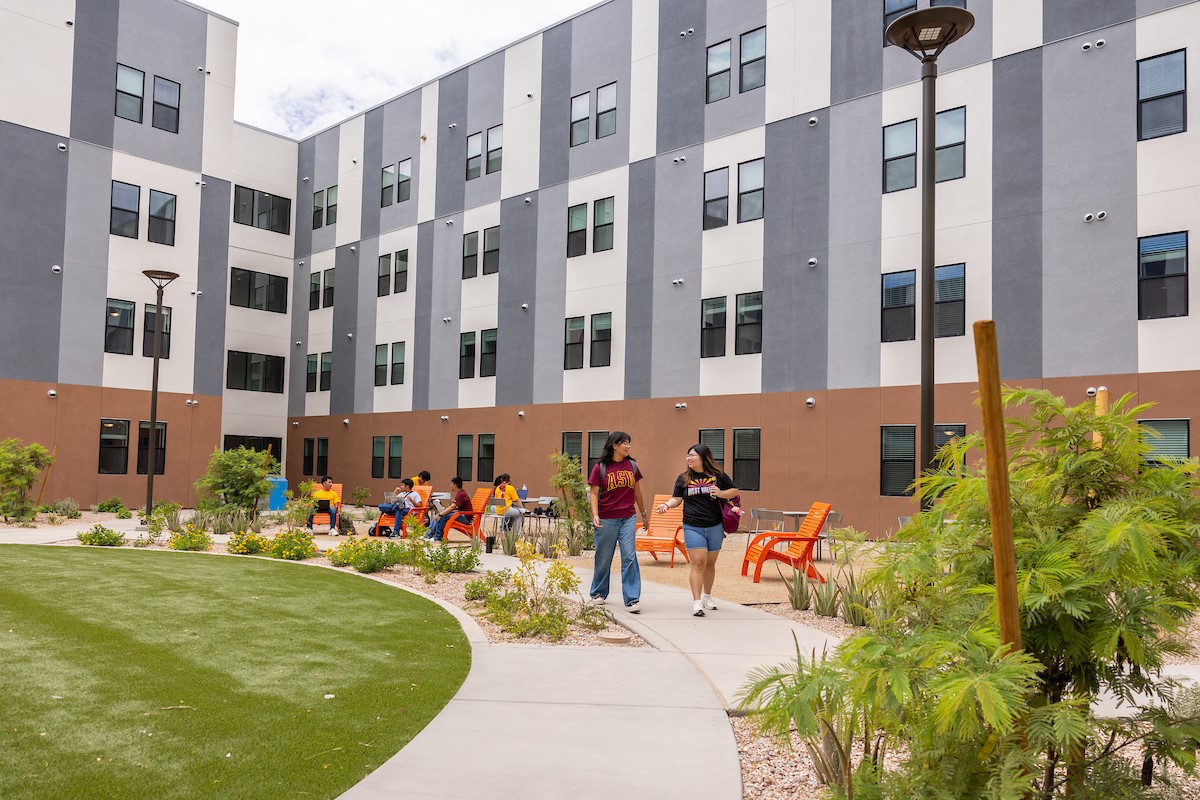 Students can be seen relaxing outside at ASU West.