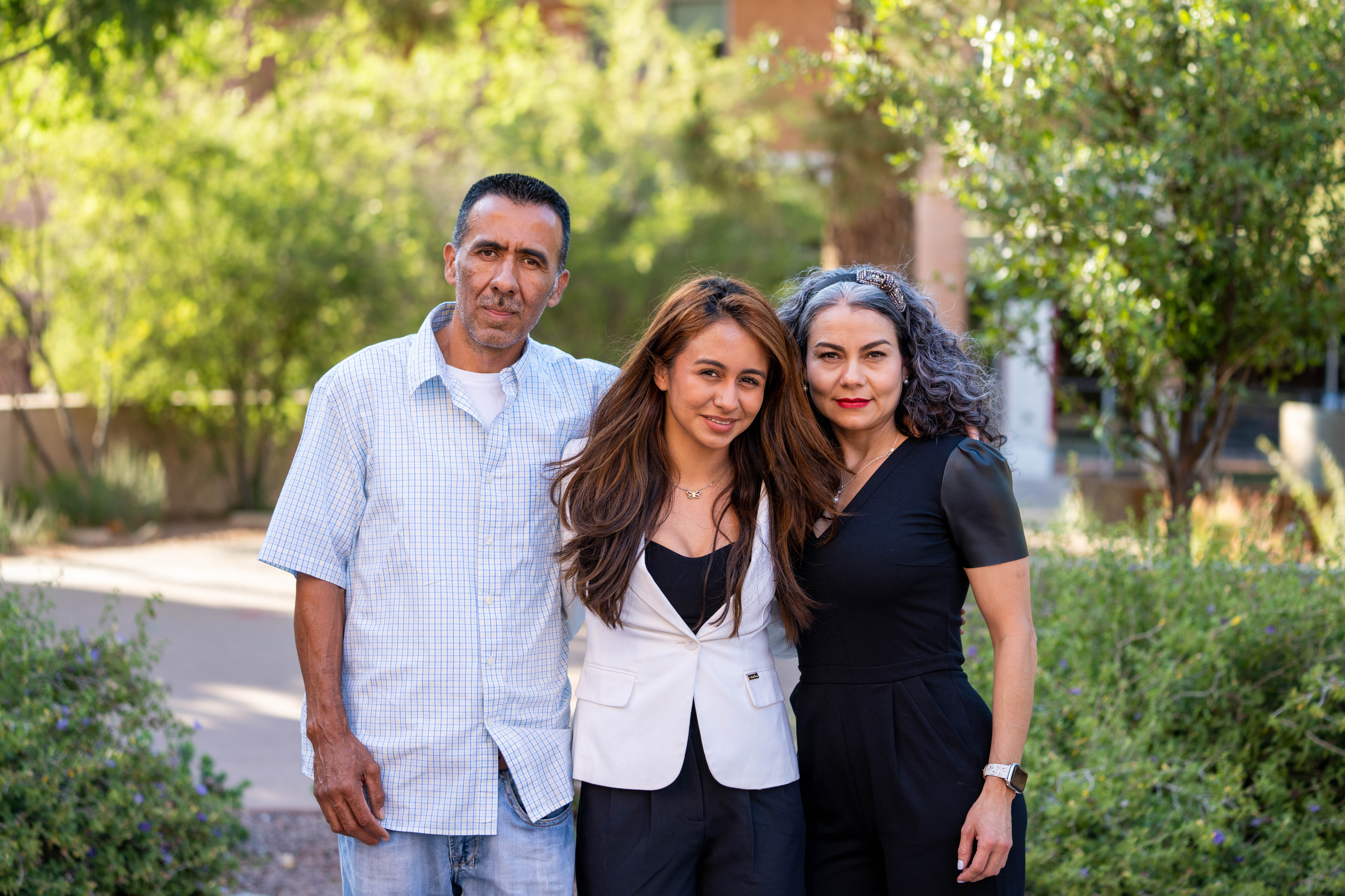 A Mother, Daughter, and Father pose for a photo Hispanic Mother Daughter Program