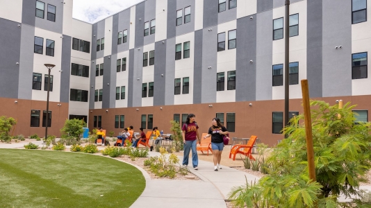 Students can be seen relaxing outside at ASU West.