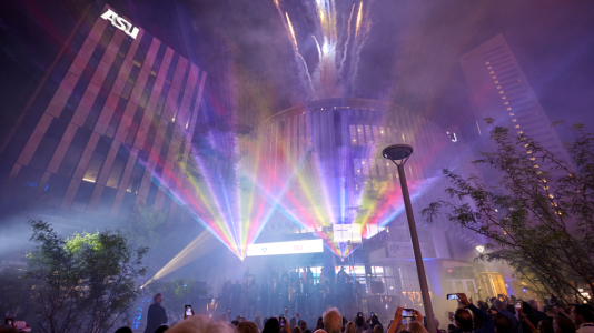 Fireworks going off above The F. Francis & Dionne Najafi Global Headquarters