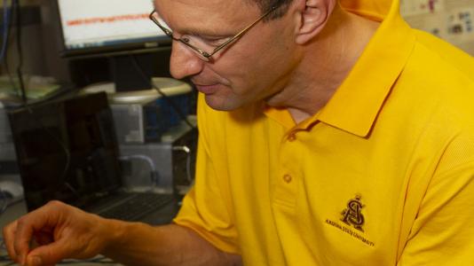 Martin Reisslein, an Arizona State University electrical and systems engineering professor, is researching 5G technology that will be a major component of the next industrial revolution.  Photo by Jessica Hochreiter/ASU. 