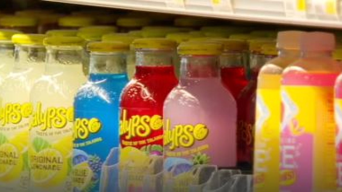 A store shelf display with sugary drinks