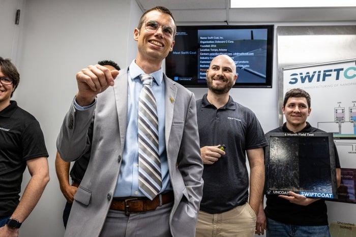 ASU Professor Zachary Holman talks about Swift Coat, the company that he and ASU alumnus Peter Firth created, during a tour of the MacroTechnology Works at the ASU Research Park in Tempe. Photo by Charlie Leight/ASU News